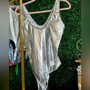 Brand new Size XL one piece silver swimming suit.